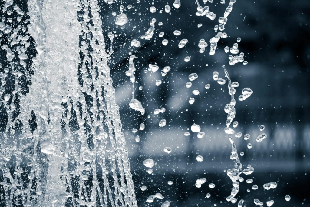 Captivating black and white image of splashing water droplets in motion.